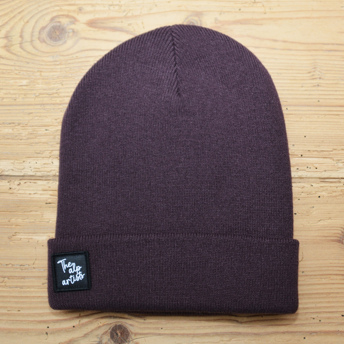 The alp artists Beanies – Textiletikette schwarz